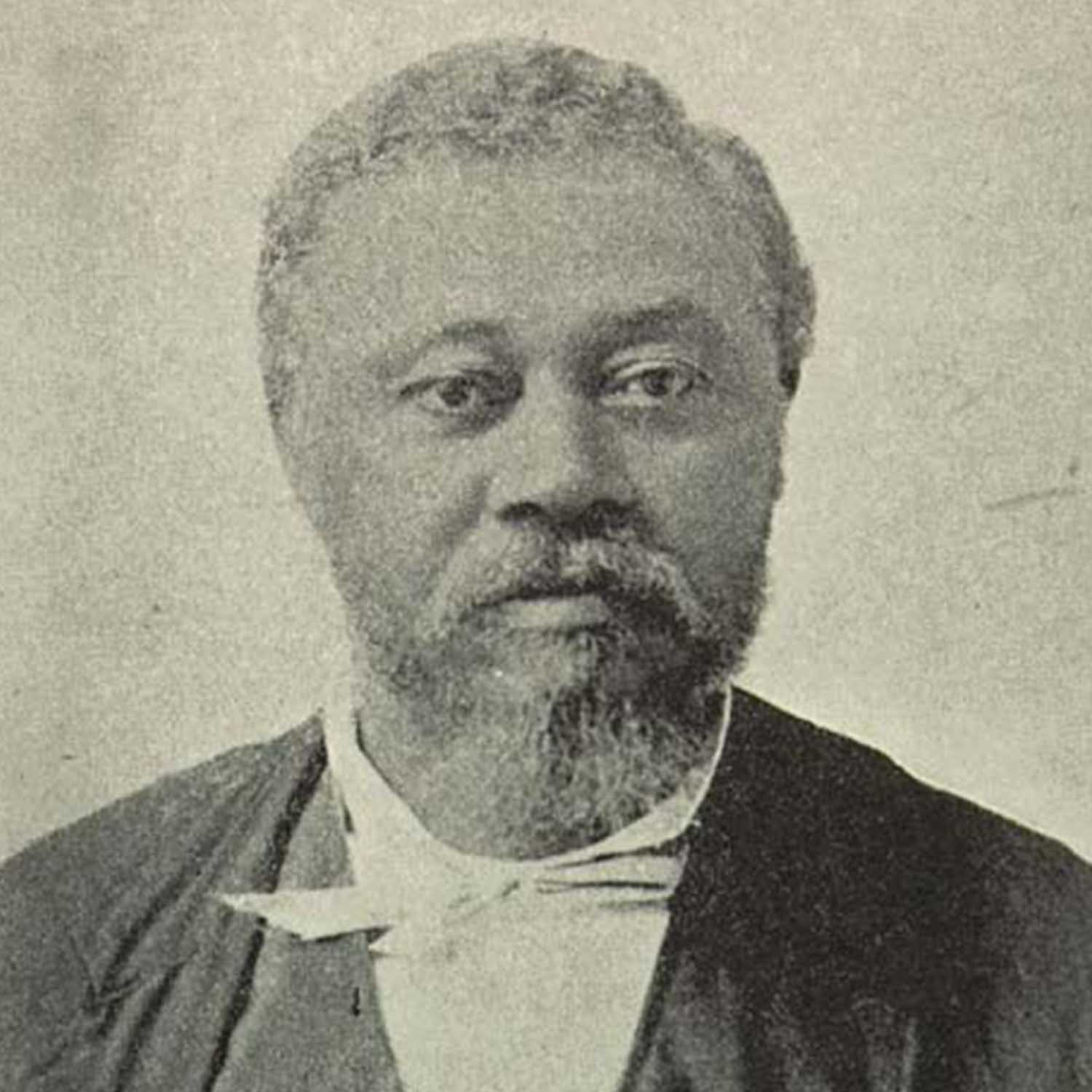 A black and white photo of an older man.